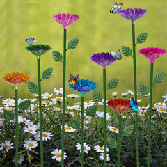 Retyion front view of eight bee watering stations brightening garden
