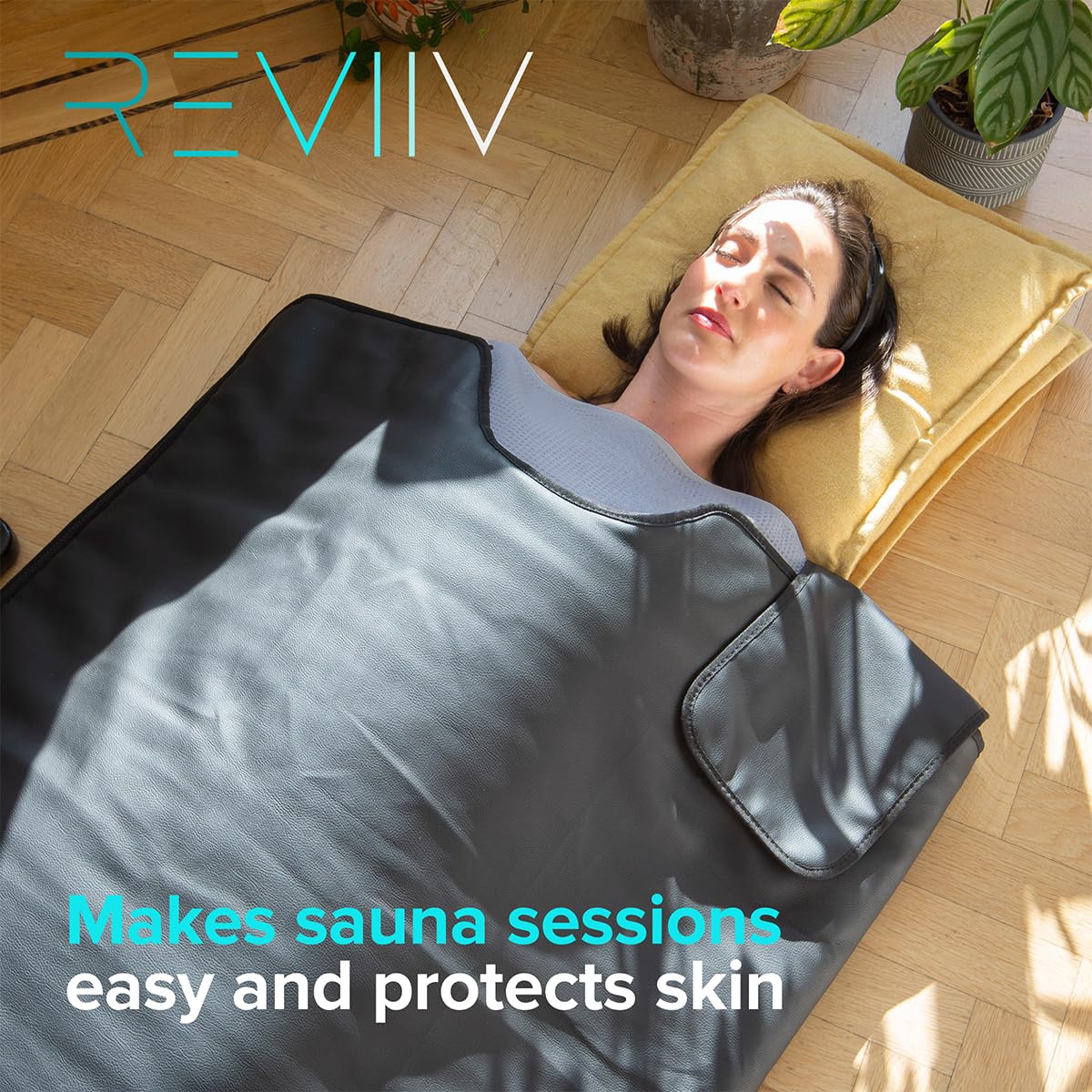 REVIIV towel laid inside portable infrared sauna blanket protecting surface