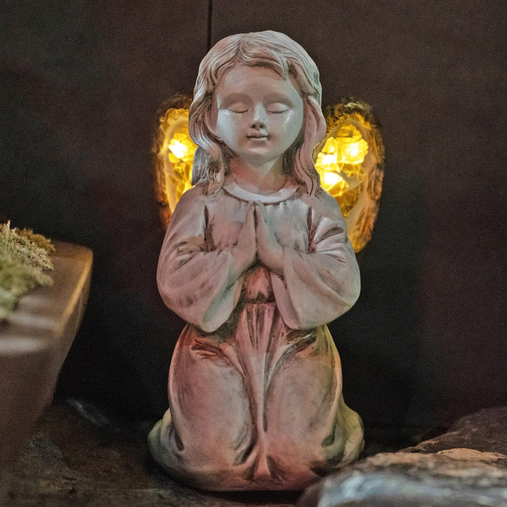 Rezpuao front view of praying angel statue showing peaceful design and welcome