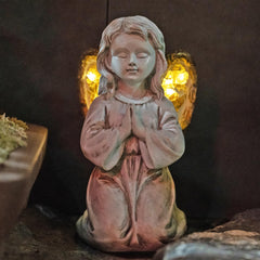 Rezpuao front view of praying angel statue showing peaceful design and welcome