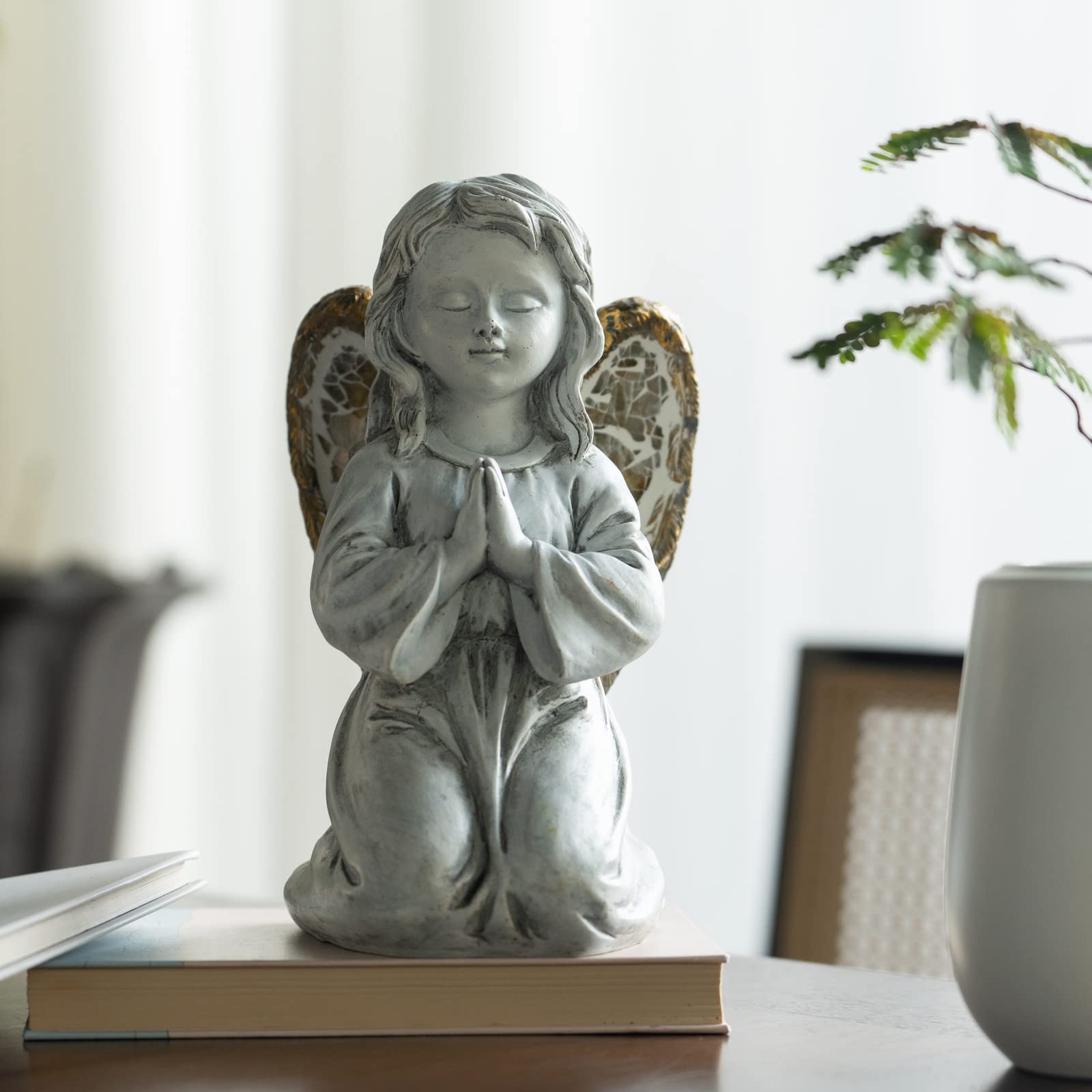 Rezpuao angel illuminated at night providing soft glowing ambiance