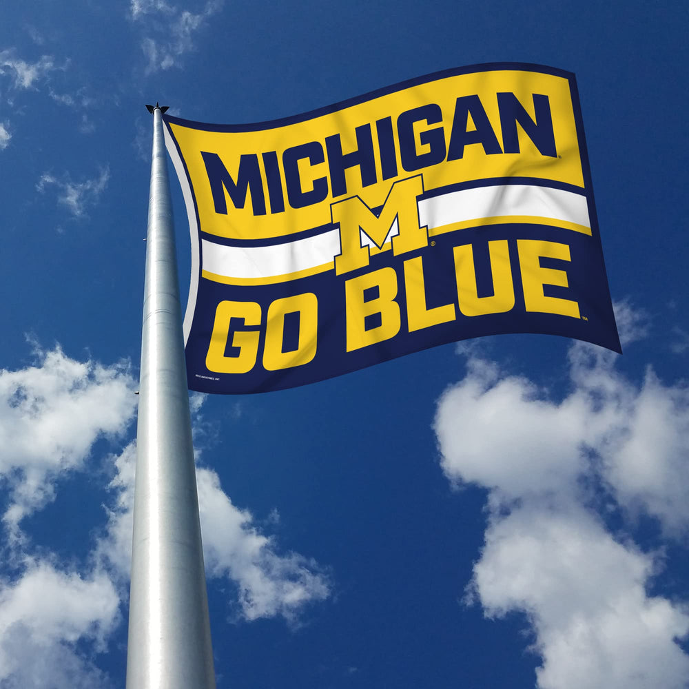 Rico Industries flag hung in a dorm room adding team spirit and vibrant decor to small spaces