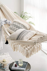 RISEON hammock hung between trees outdoors, demonstrates portable relaxation setup