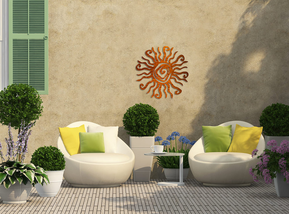 Riverside Designs Wacky Sun on garden wall showing lively outdoor décor benefit