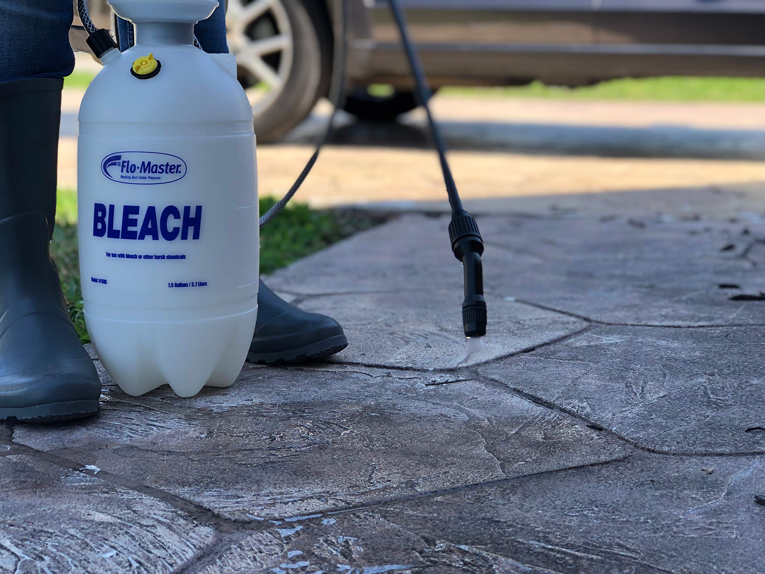 RL FLOMASTER spraying a railing to show reach and targeted application benefit