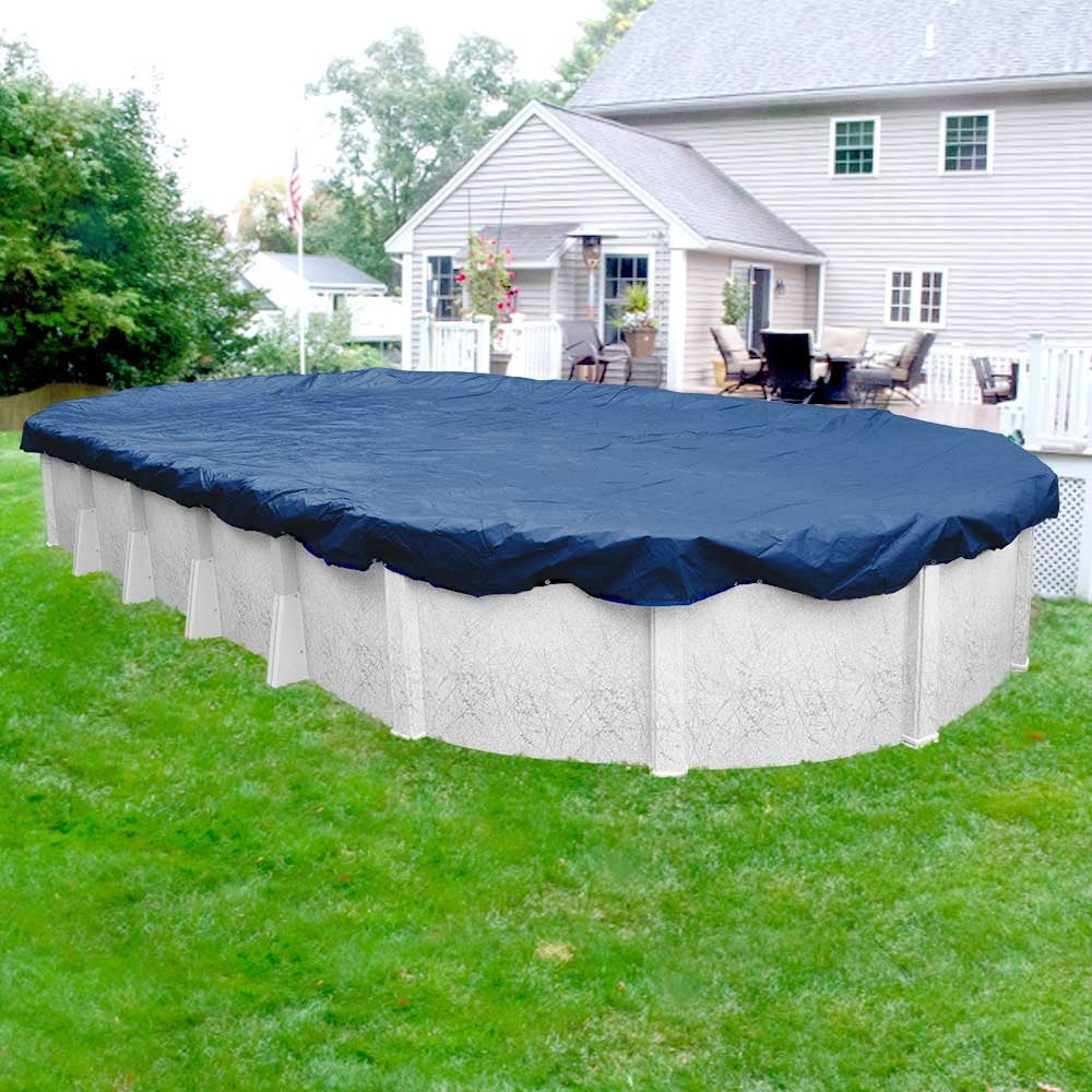 Robelle installed on an oval above-ground pool keeping out snow and debris