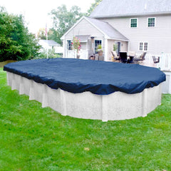 Robelle installed on an oval above-ground pool keeping out snow and debris