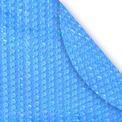 Robelle oval solar cover front view on pool showing fit and heat retention