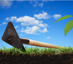 Rogue & Arcadian hoe in use slicing soil between vegetable rows for efficient weeding and soil shaping