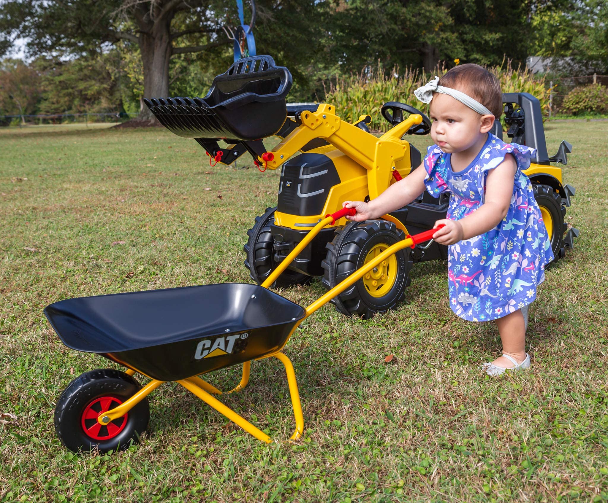 ROLly TOYS beside child for scale demonstrating child-friendly size and manageability benefit