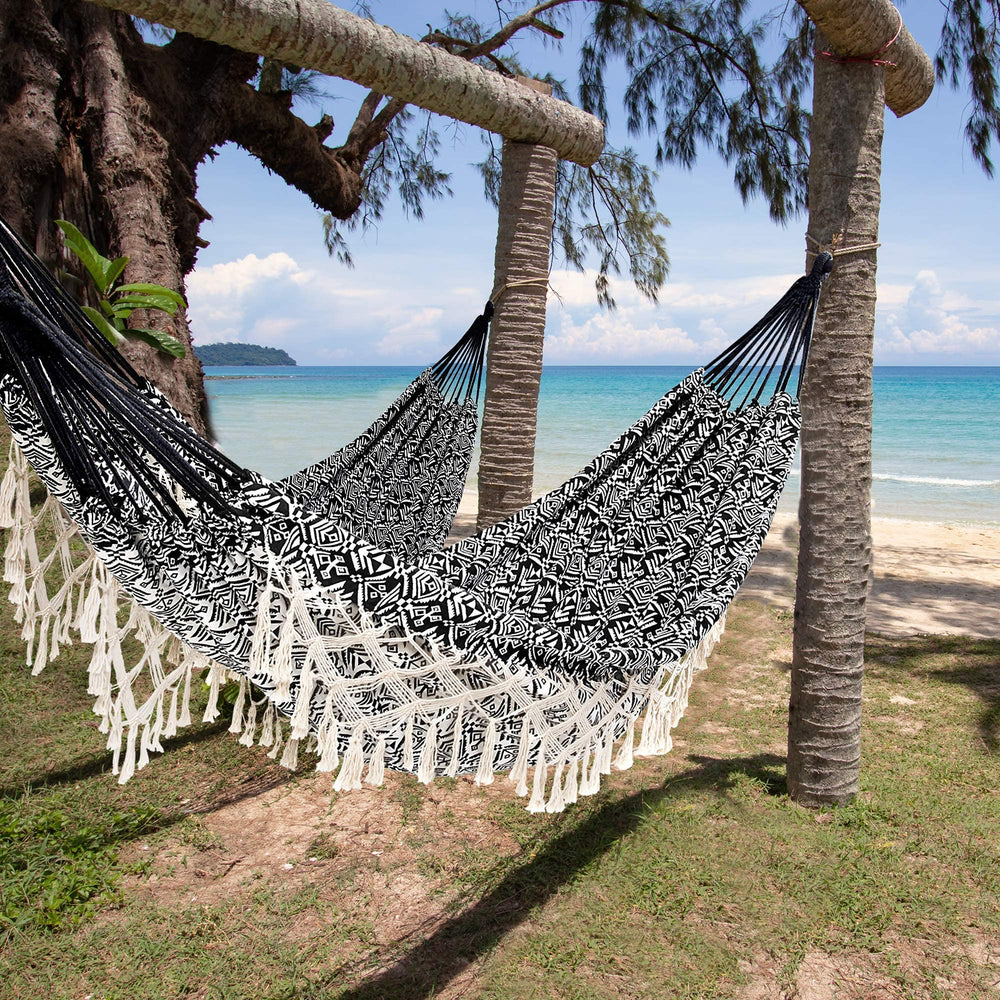 ROOITY hammock in use with couple on porch showing relaxation and capacity