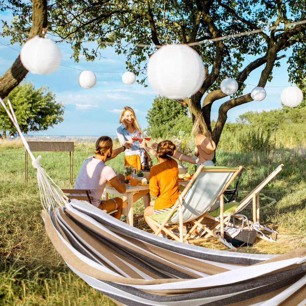 ROOITY hammock on a porch lifestyle shot conveying outdoor relaxation appeal