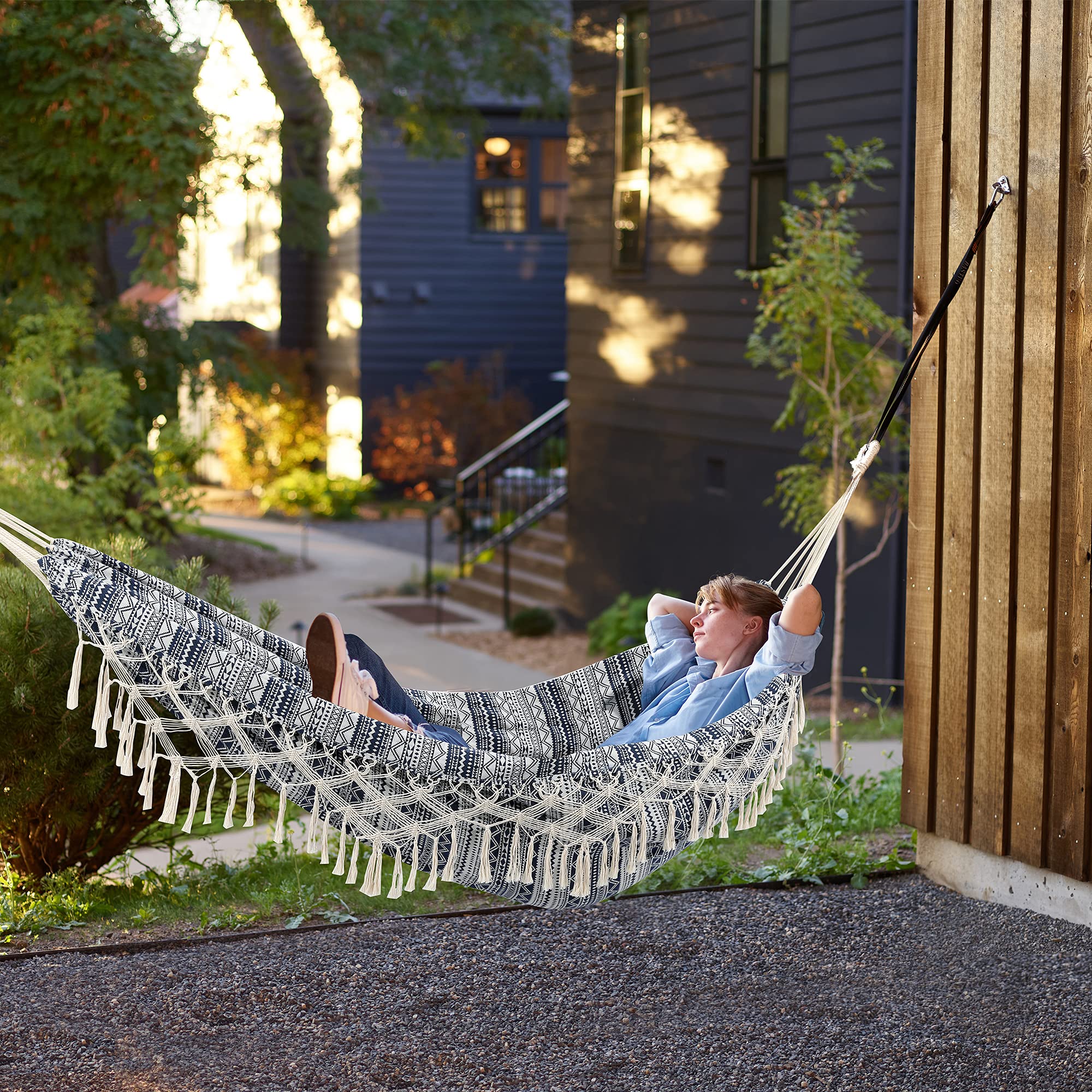 ROOITY hammock set up on a beach showing portability and outdoor relaxation