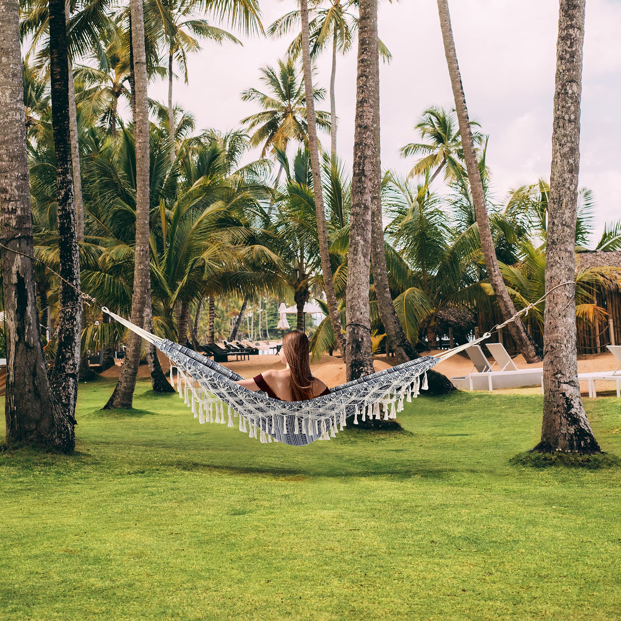 ROOITY hammock displayed next to a chair for scale to show generous bed size