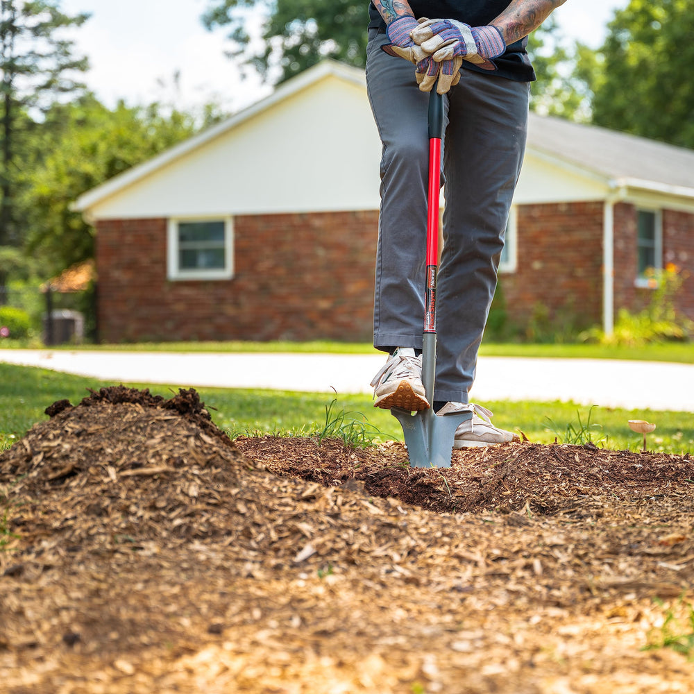Root Slayer Nomad in a campsite scene as a travel-ready digging tool