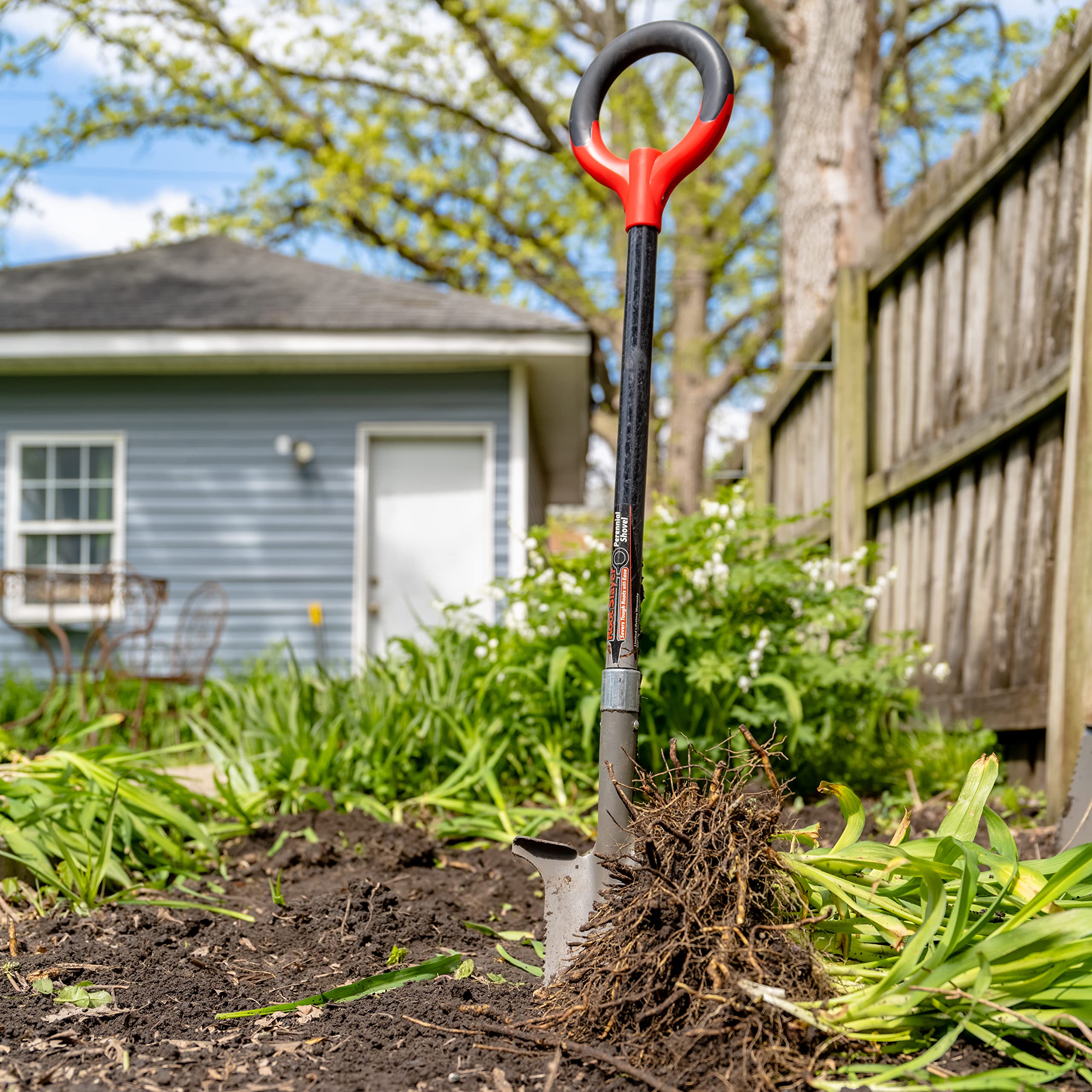 Root Slayer next to a hand and pot to show compact size and easy maneuverability
