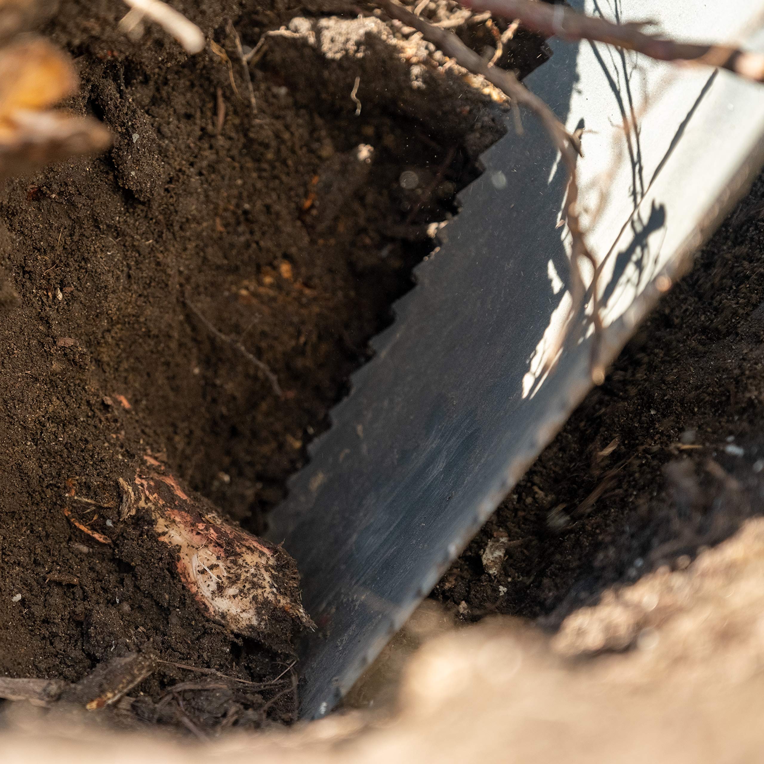 Root Slayer next to measuring tape showing 57.5-inch length for improved reach