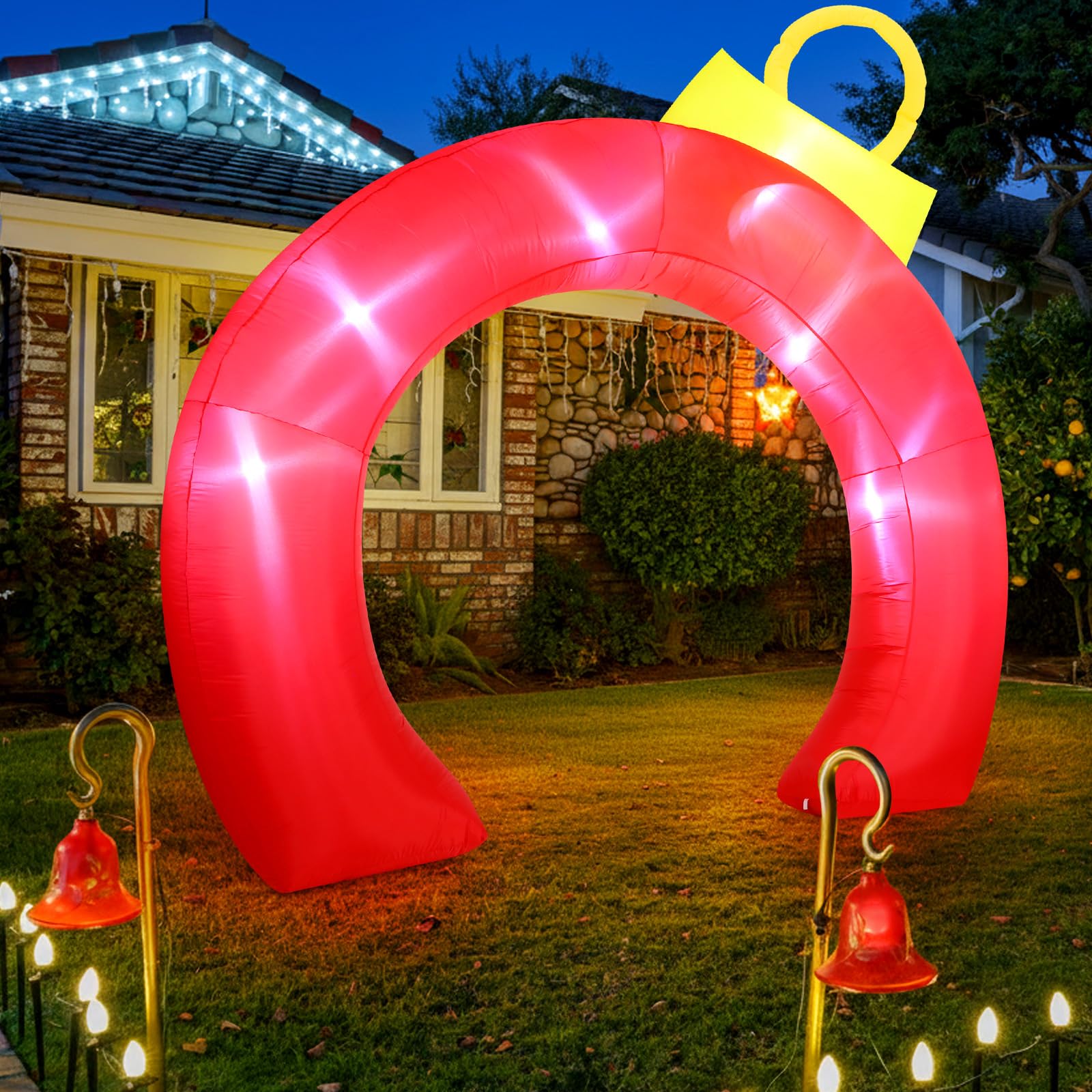 Rossesay arch lit at night on lawn creating welcoming party focal point
