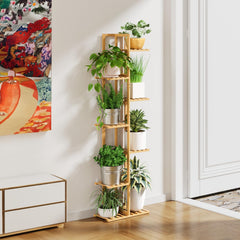 ROSSNY plant stand in living room demonstrating space-saving display benefit