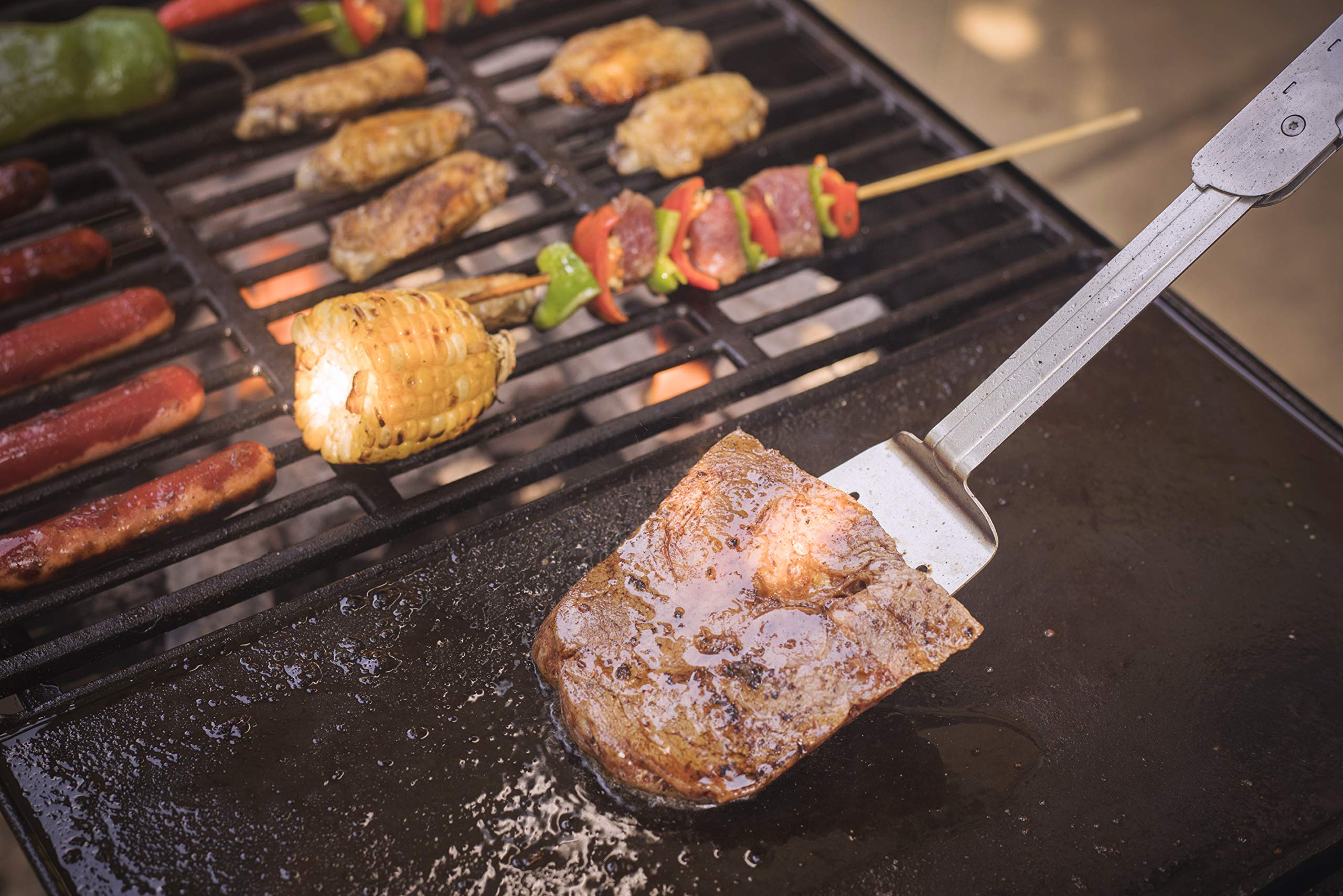 ROXON in use on griddle flipping burgers for efficient cooking