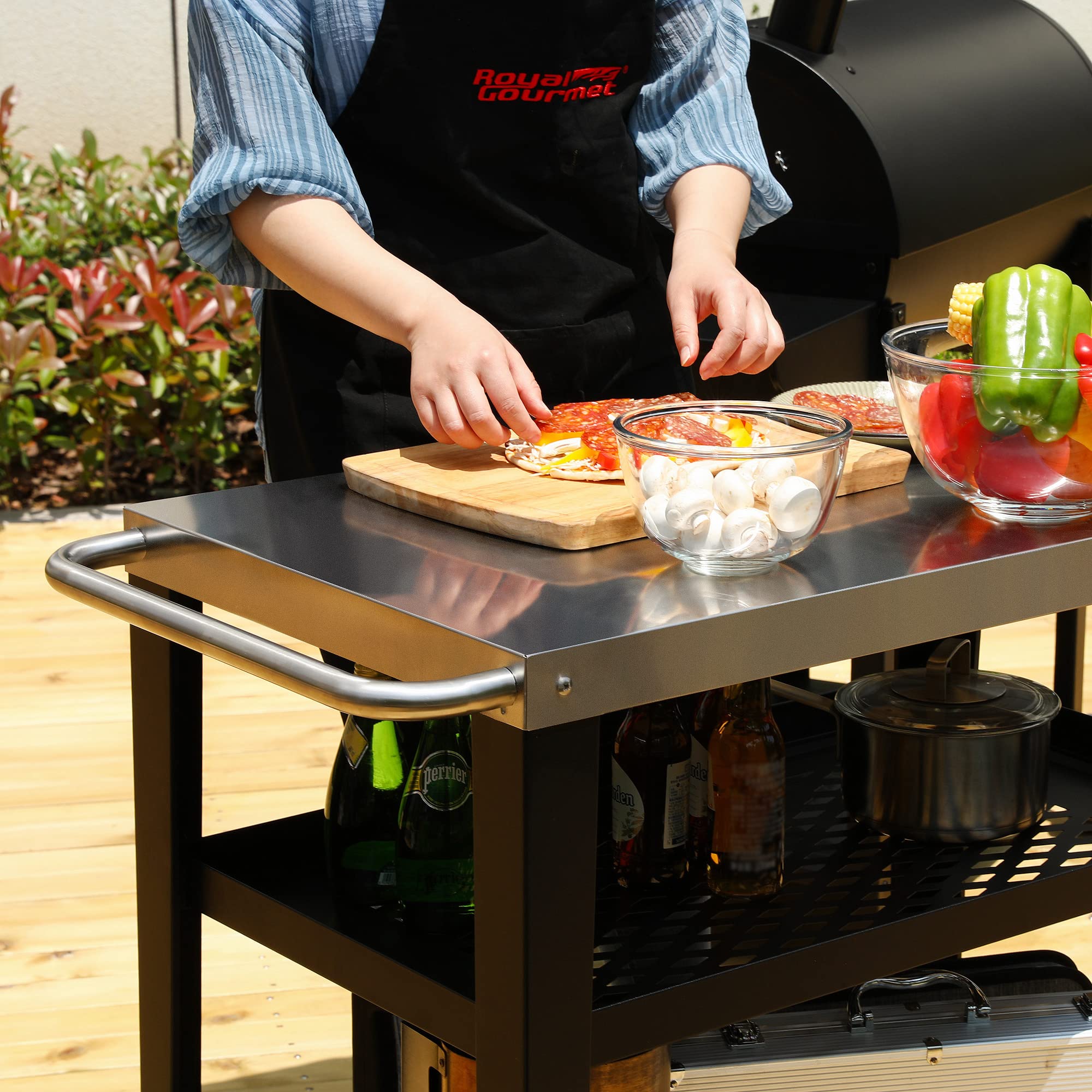 Royal Gourmet next to a grill showing size and compatibility for outdoor cooking