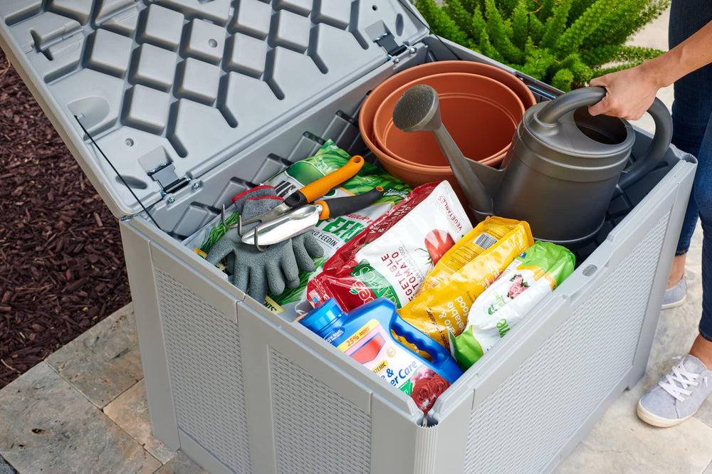 Rubbermaid deck box open lid revealing easy-access hinges and spacious interior for quick retrieval