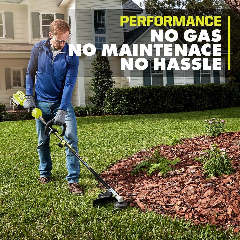RYOBI trimmer in yard with Expand-It attachment showing versatile tool use