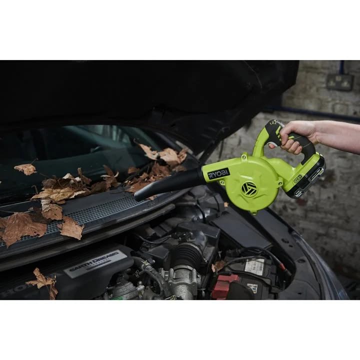 RYOBI blower in workshop use clearing sawdust for faster bench cleanup