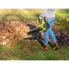 RYOBI blower beside a battery for scale showing compact storage benefit