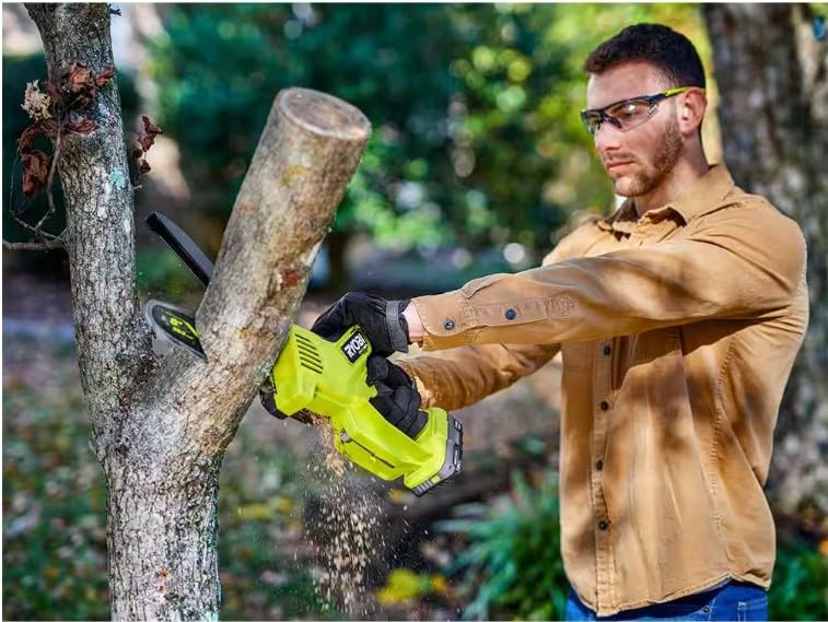RYOBI chainsaw in a garden setting showing practical use and reach