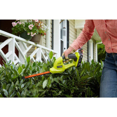 RYOBI P2900B held beside ruler to show compact size and portability