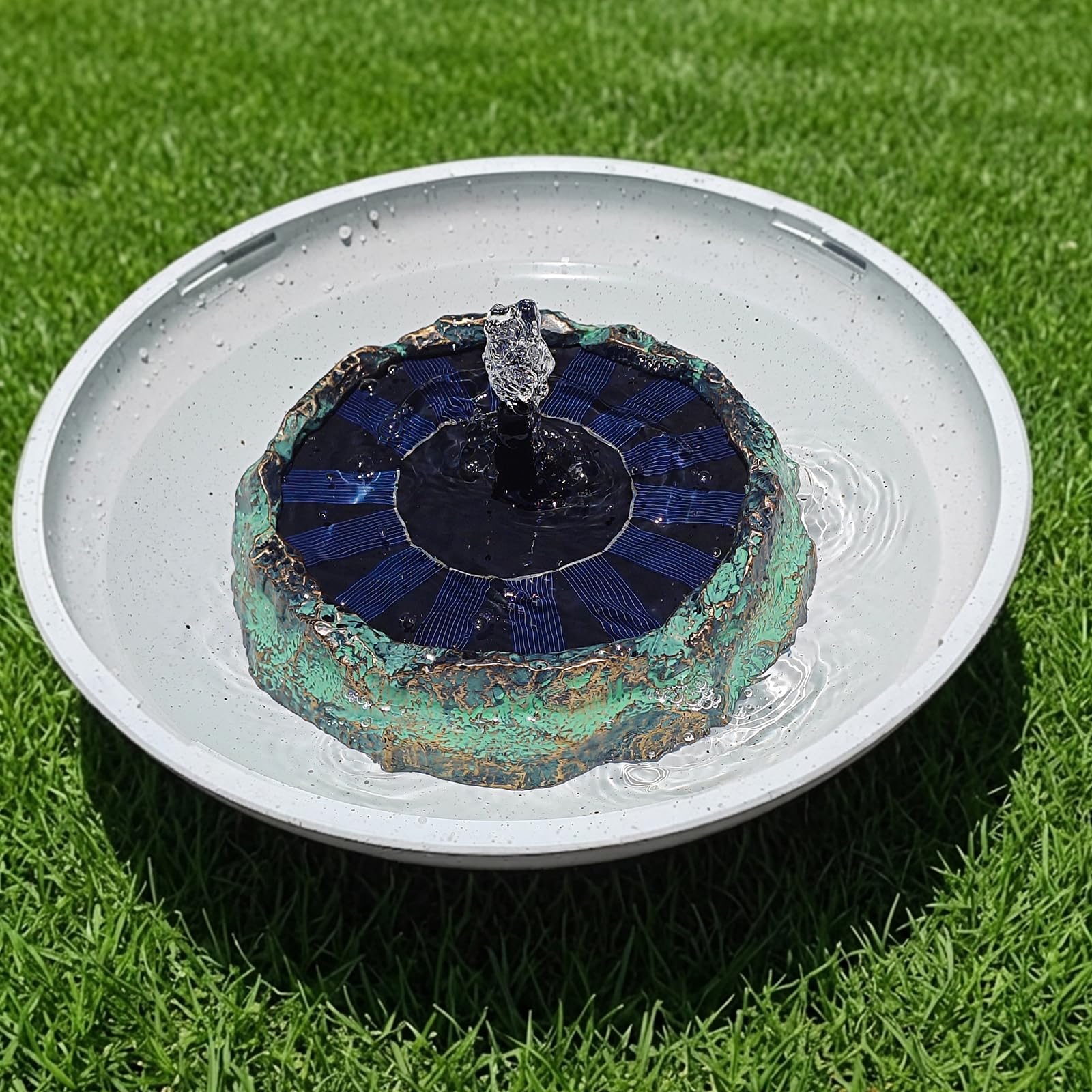 SAC SMARTEN ARTS installed in a garden birdbath creating a natural focal point and soothing sound