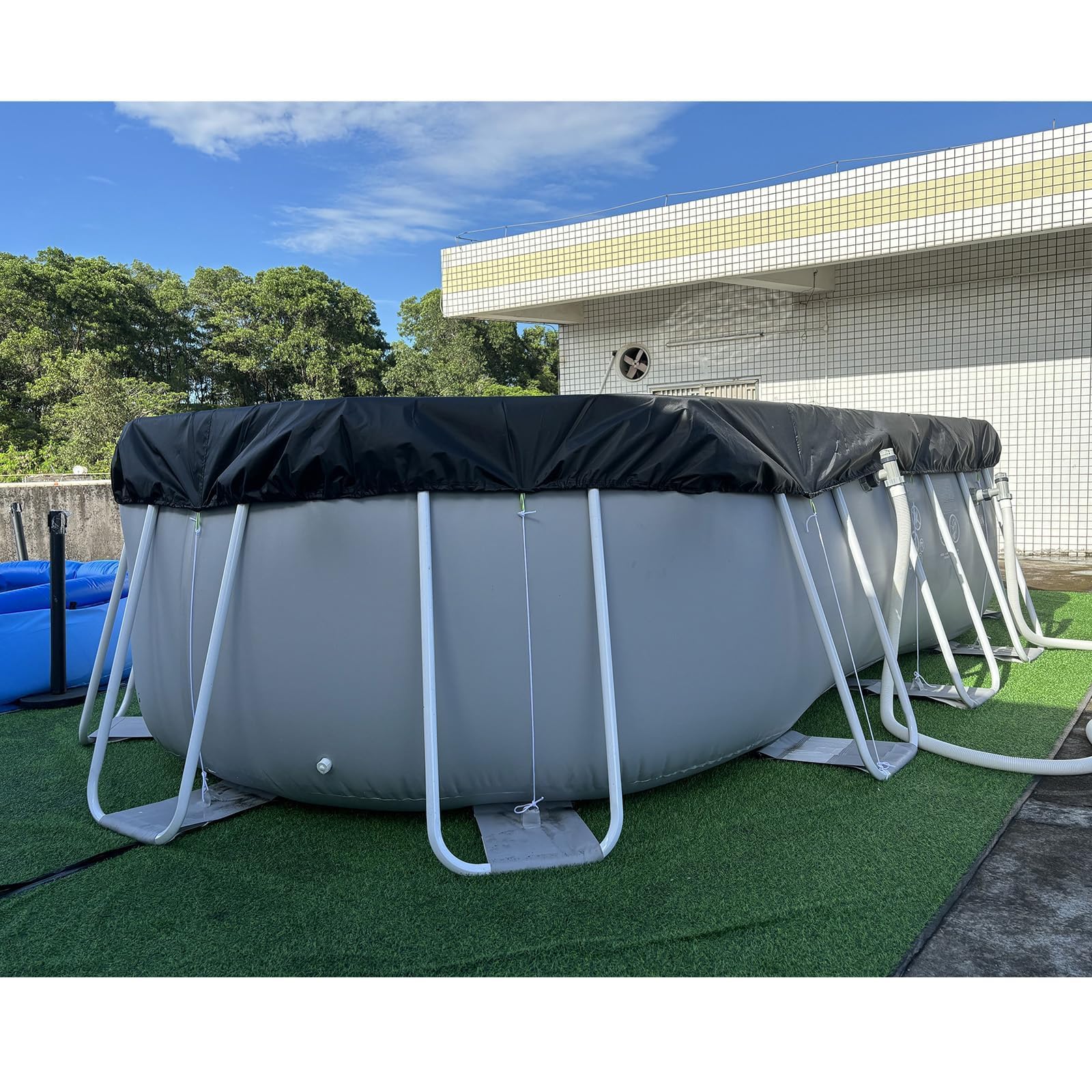 Safana backyard lifestyle showing cover in use to protect pool water