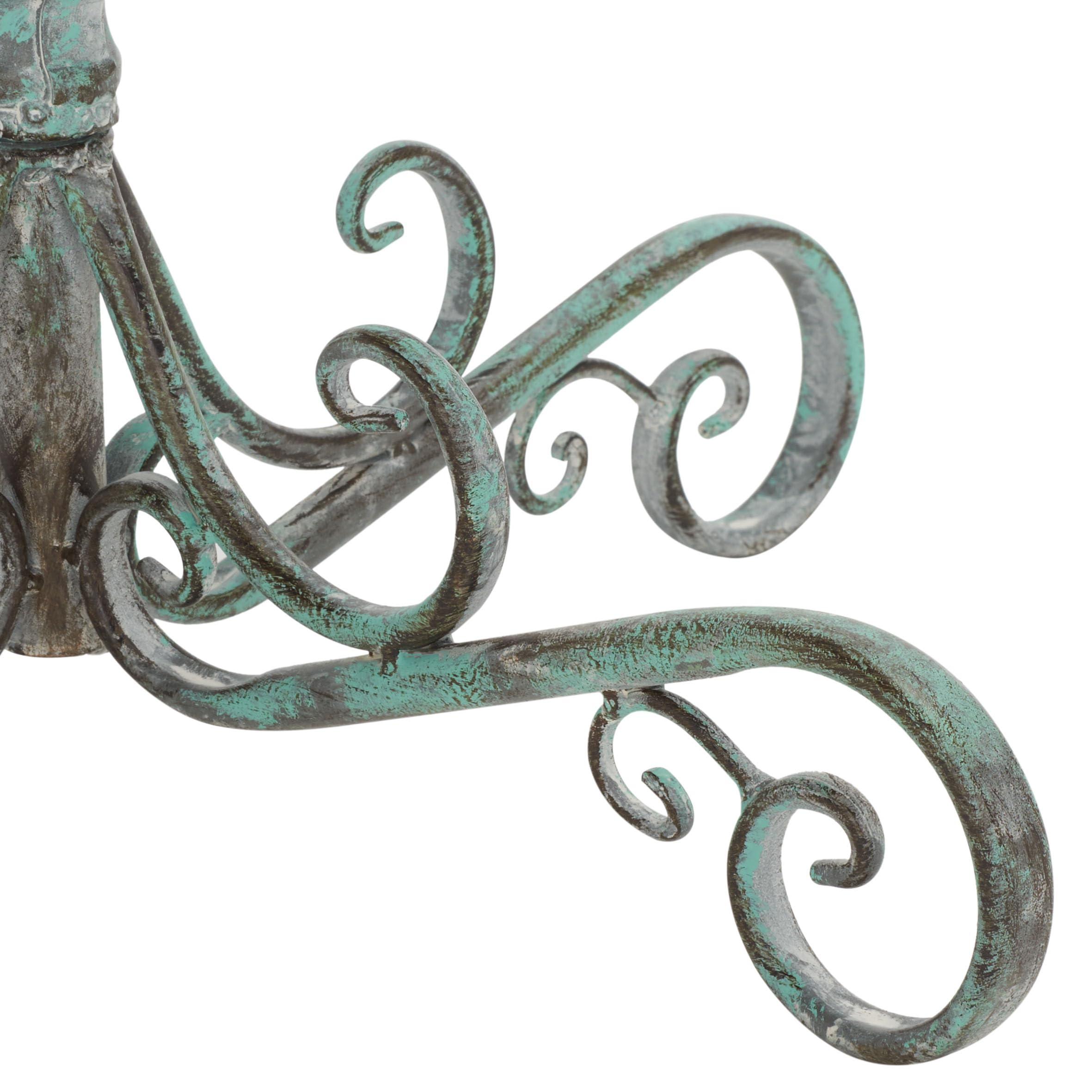SAFAVIEH bird bath placed in a garden adding vintage character and wildlife appeal