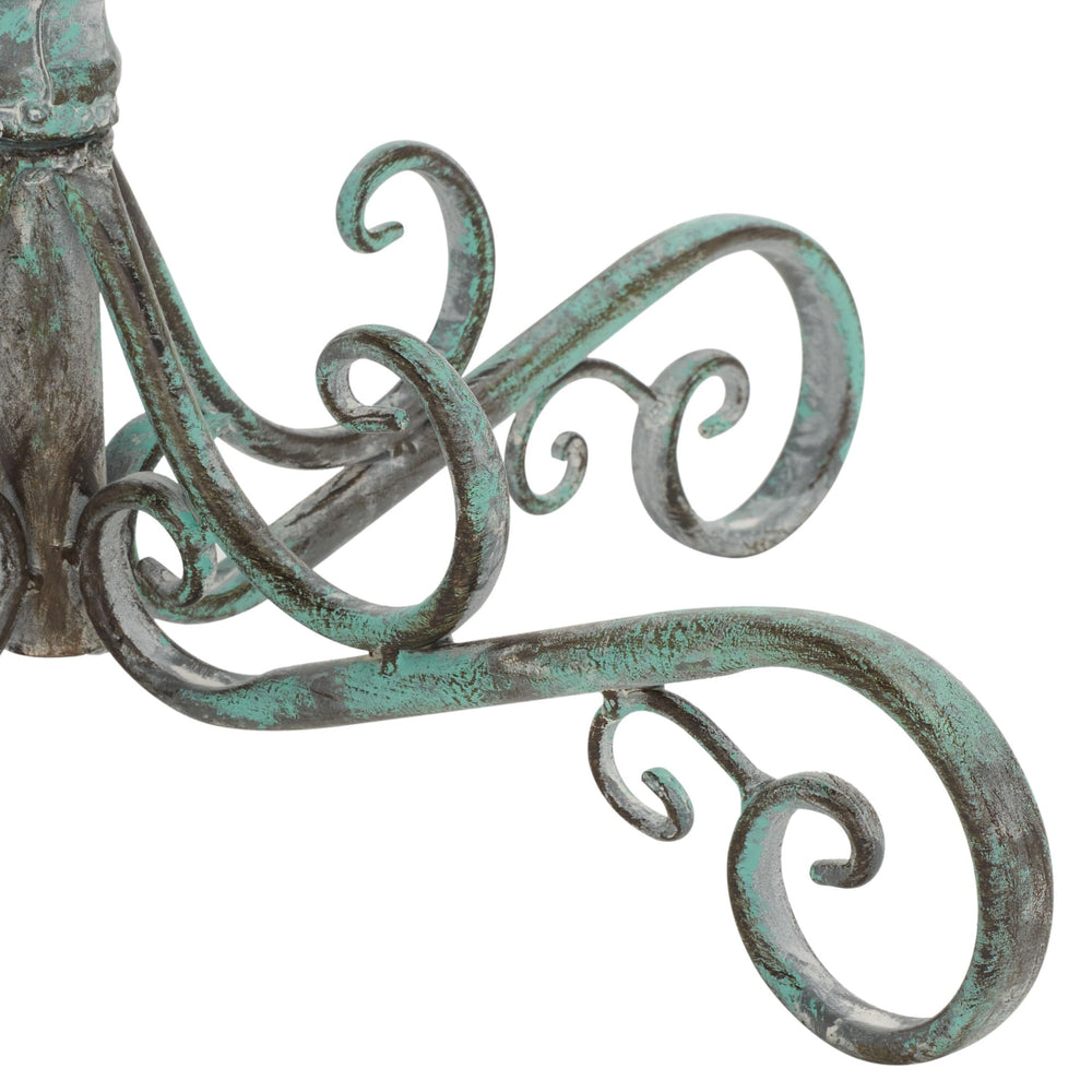 SAFAVIEH bird bath placed in a garden adding vintage character and wildlife appeal
