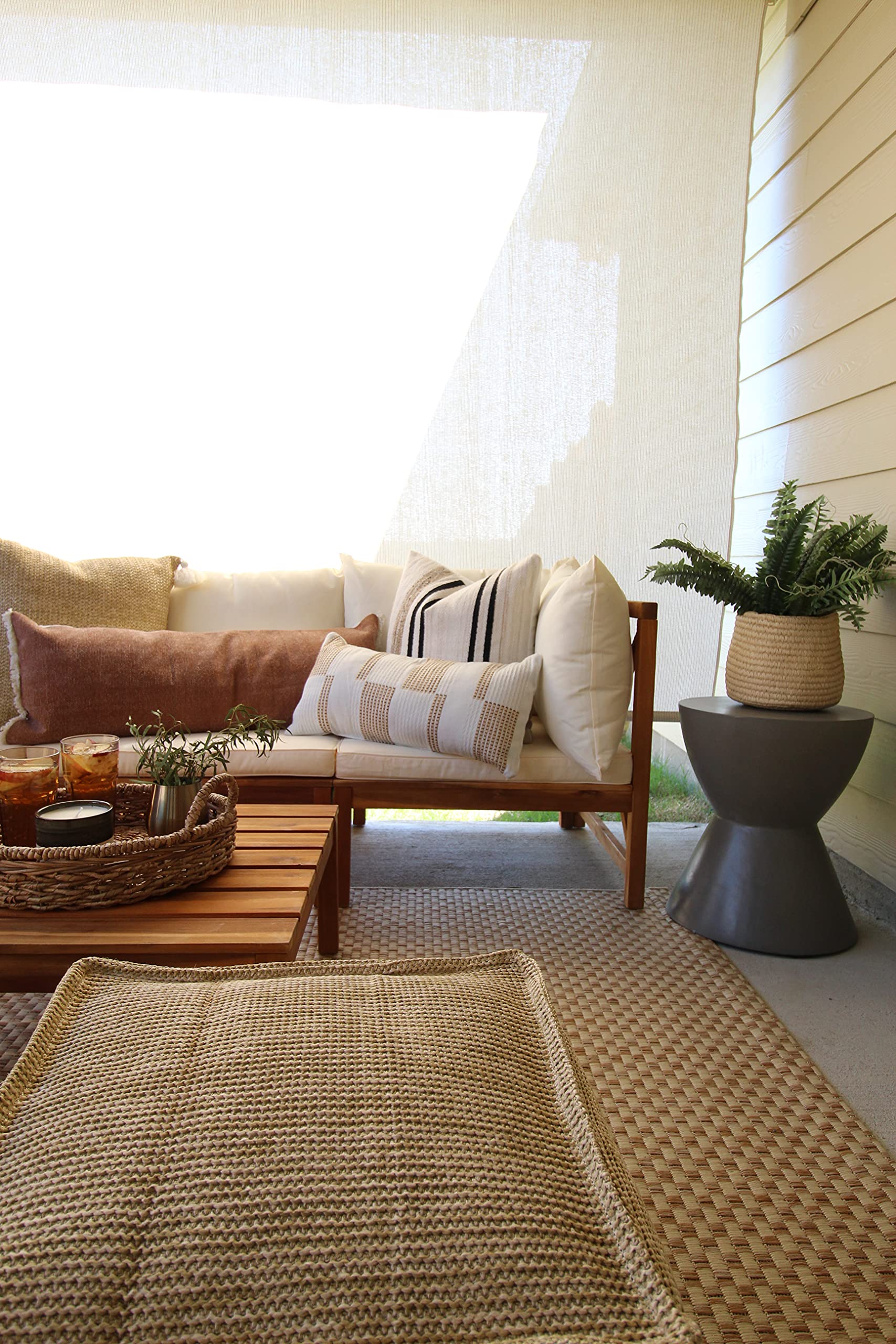 SAFAVIEH runner placed on patio showing weather resistance and stylish benefit