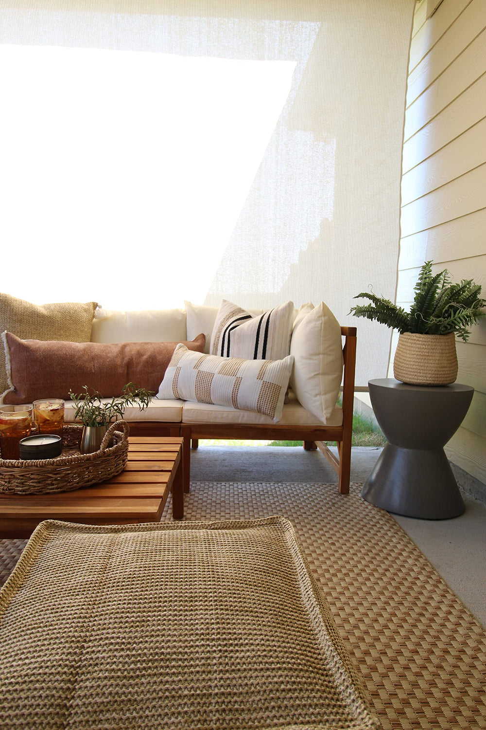 SAFAVIEH runner placed on patio showing weather resistance and stylish benefit