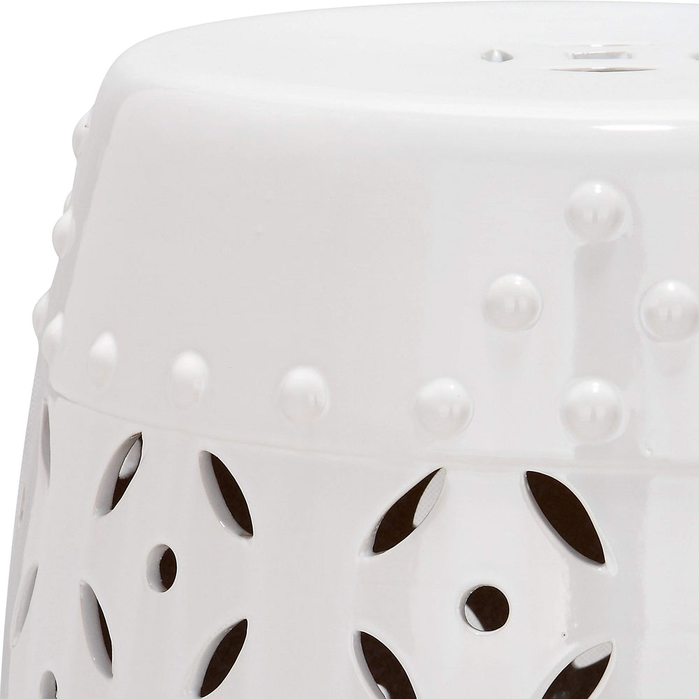 SAFAVIEH stool used as plant stand demonstrating stable ceramic surface and visual lift for greenery