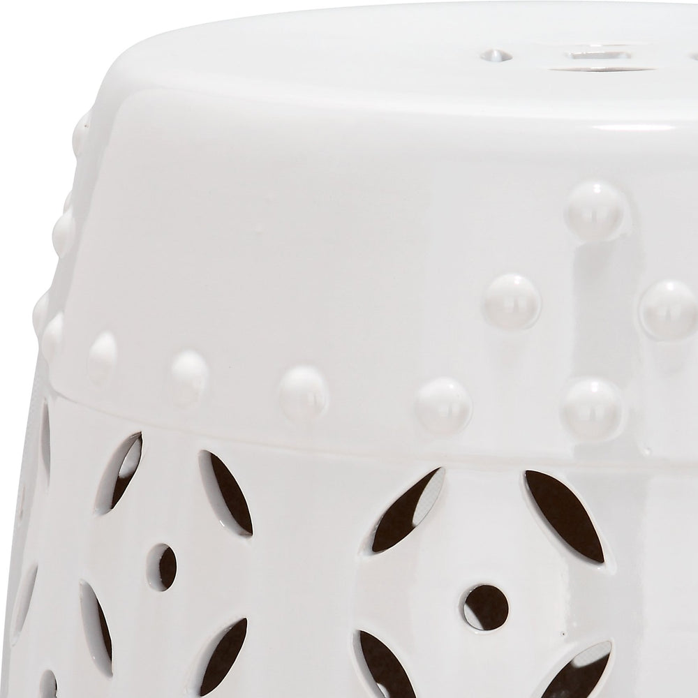 SAFAVIEH stool beside sofa showing scale and multiuse function as side table or extra seat