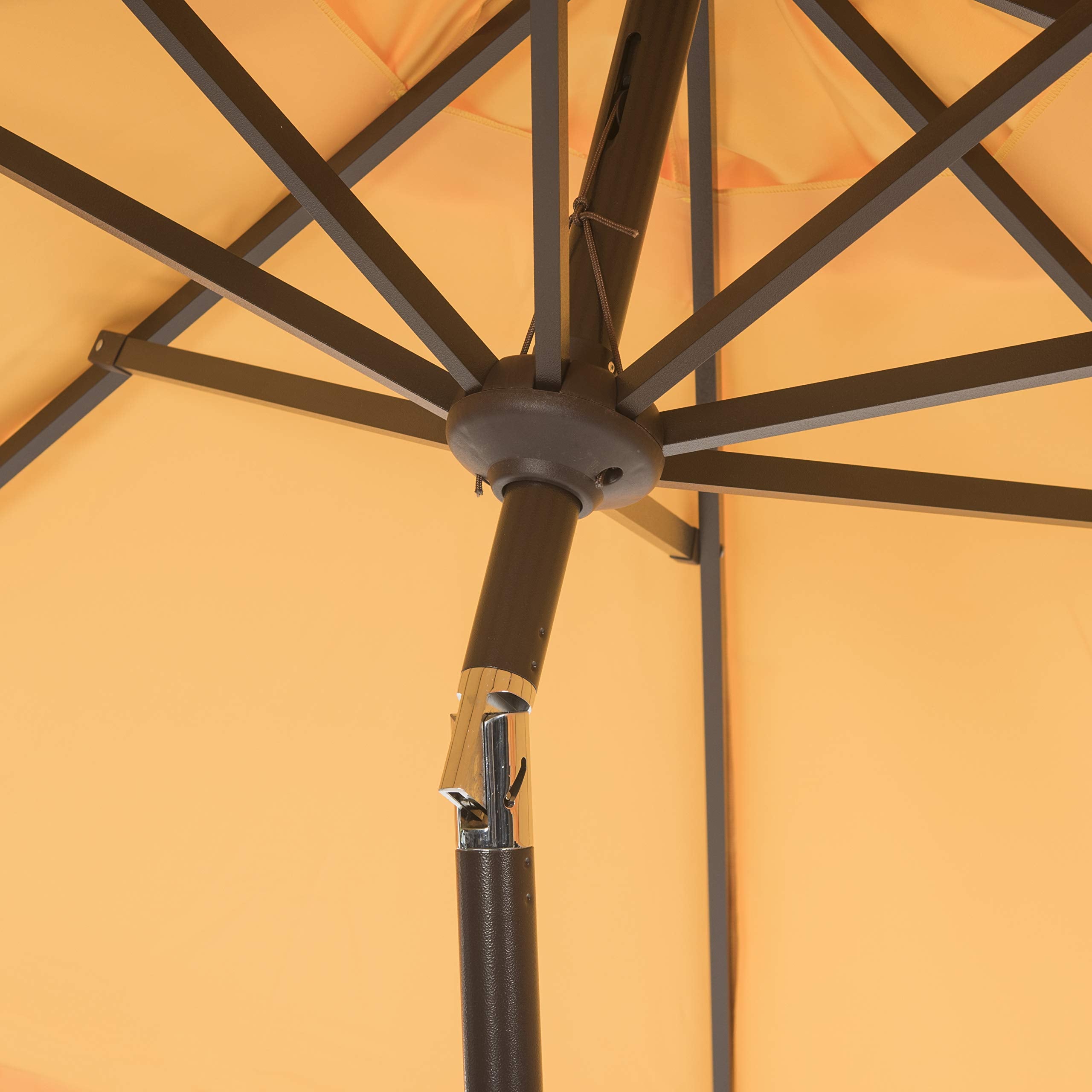 SAFAVIEH folded umbrella profile showing compact storage convenience