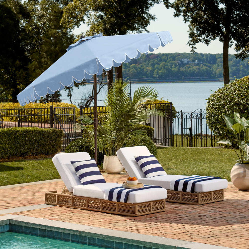 SAFAVIEH umbrella shading poolside lounge area for comfortable outdoor seating