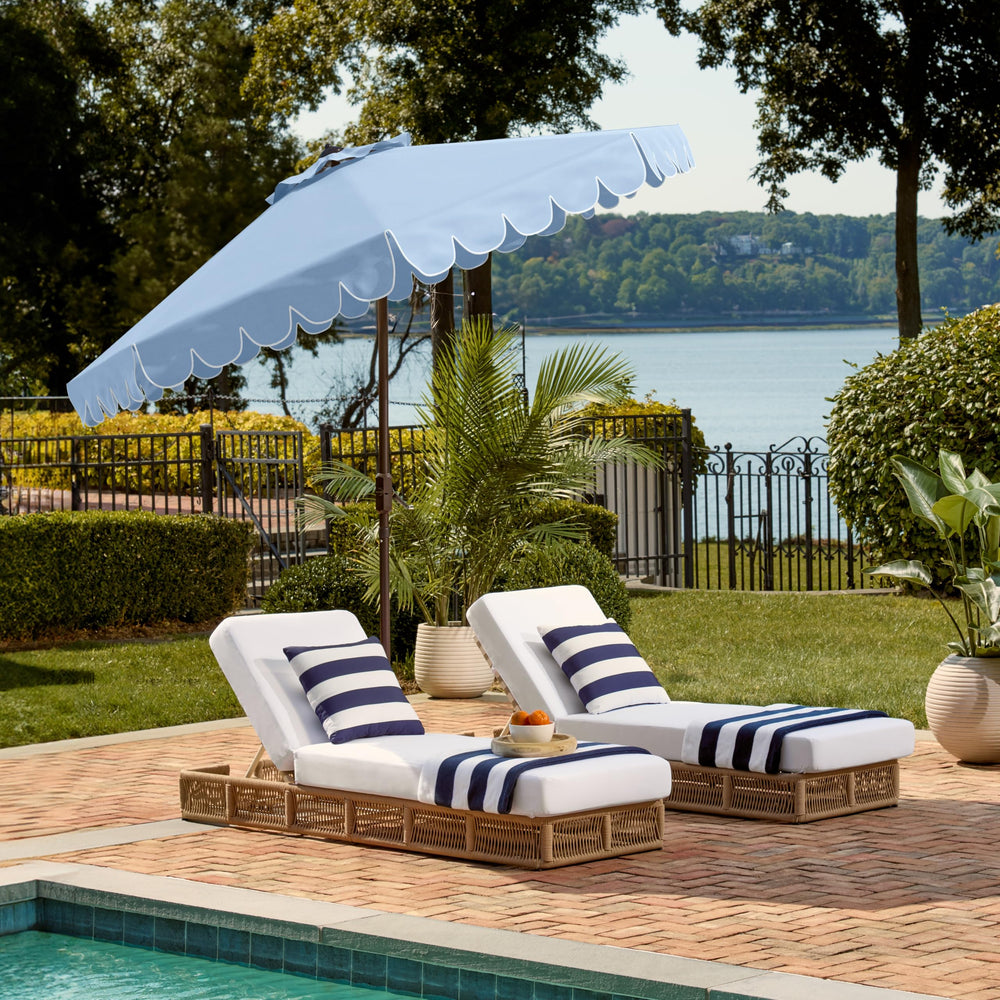 SAFAVIEH umbrella beside table and chairs showing size and coverage
