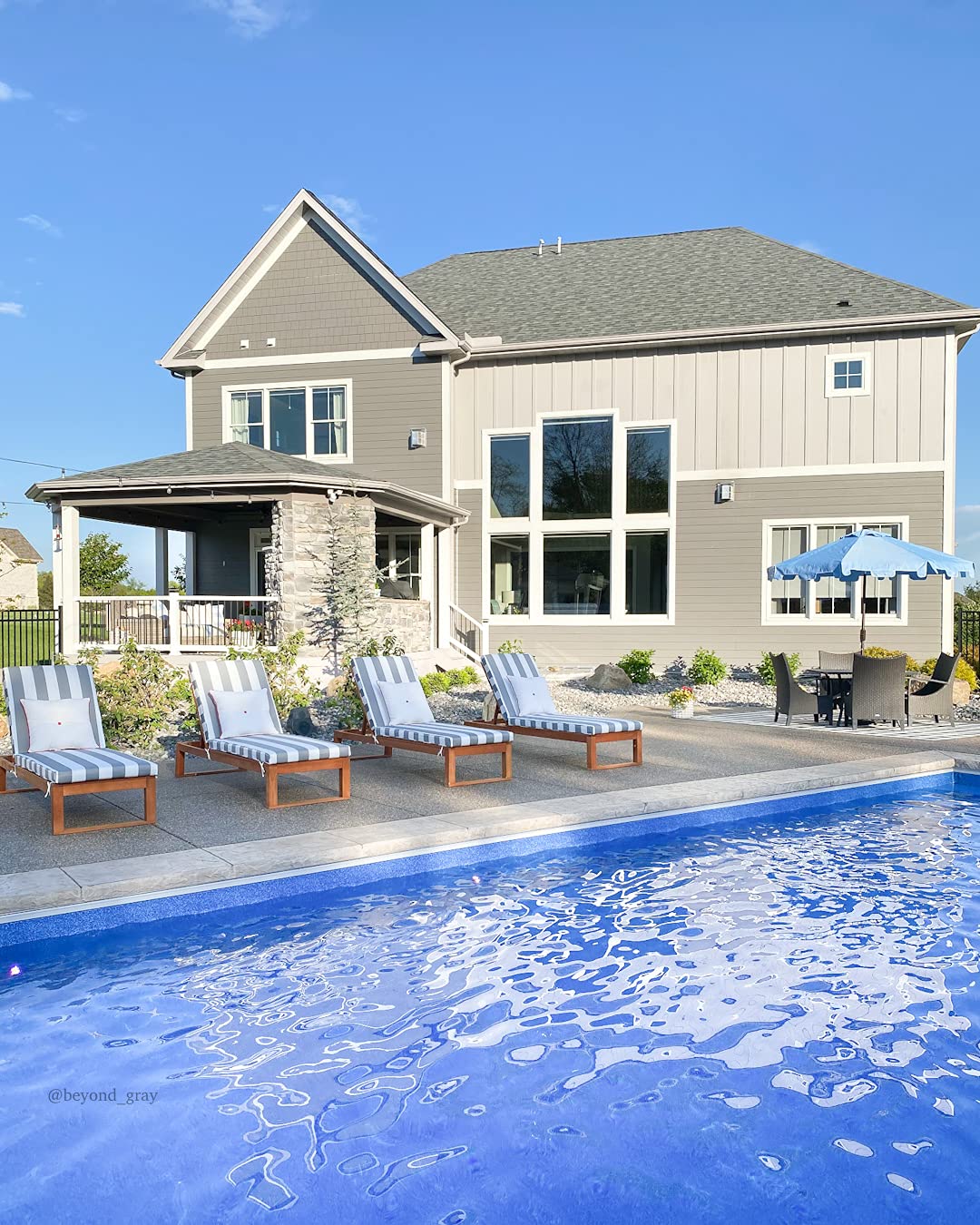 SAFAVIEH Zimmerman staged on patio providing cool, resort-style outdoor shade