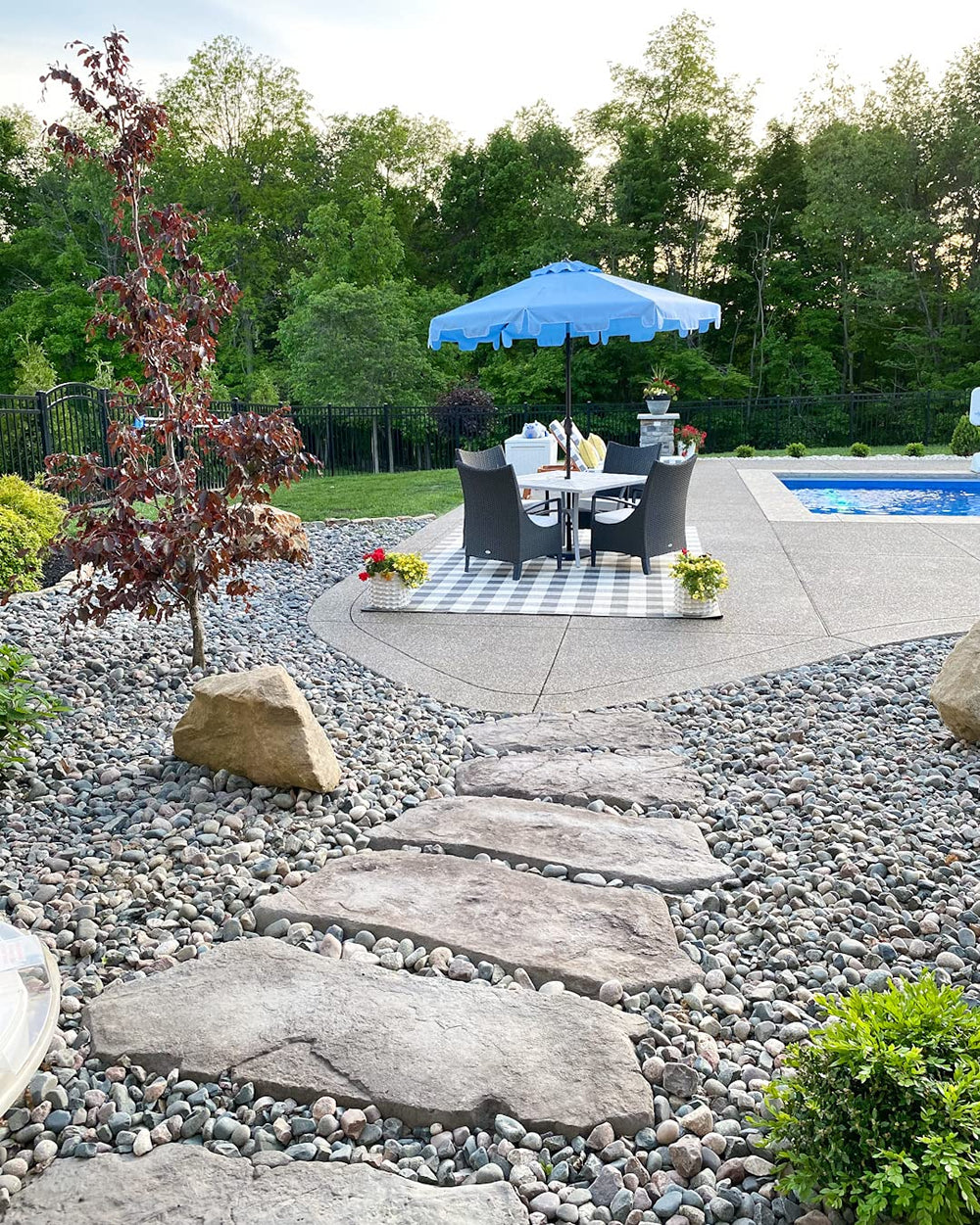 SAFAVIEH Zimmerman next to table showing 9-foot canopy scale and coverage