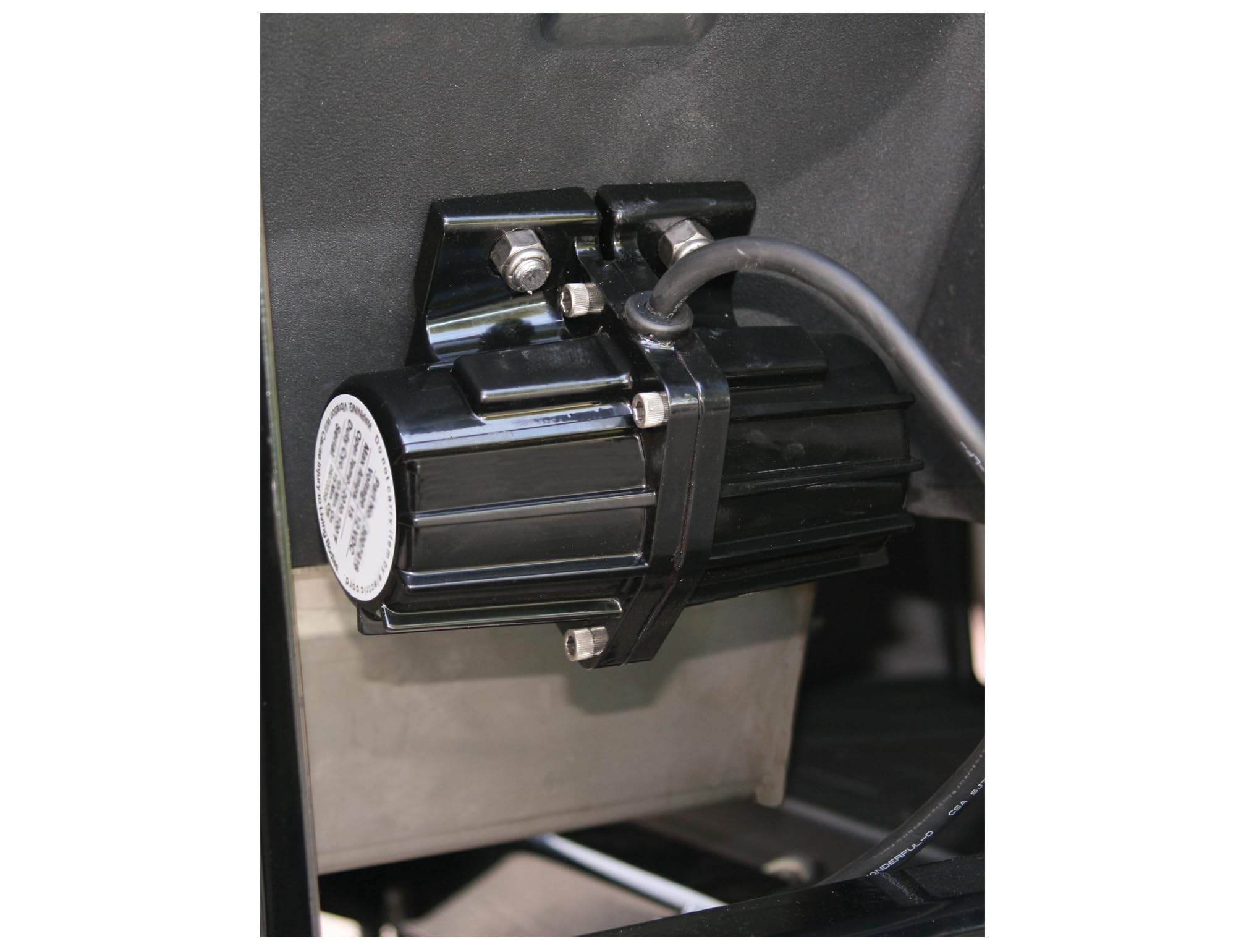 SaltDogg vibrator installed on tailgate showing improved salt distribution
