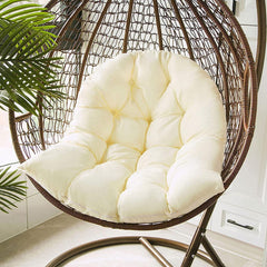 Samtiny cushion installed in hanging chair demonstrating cozy outdoor seating