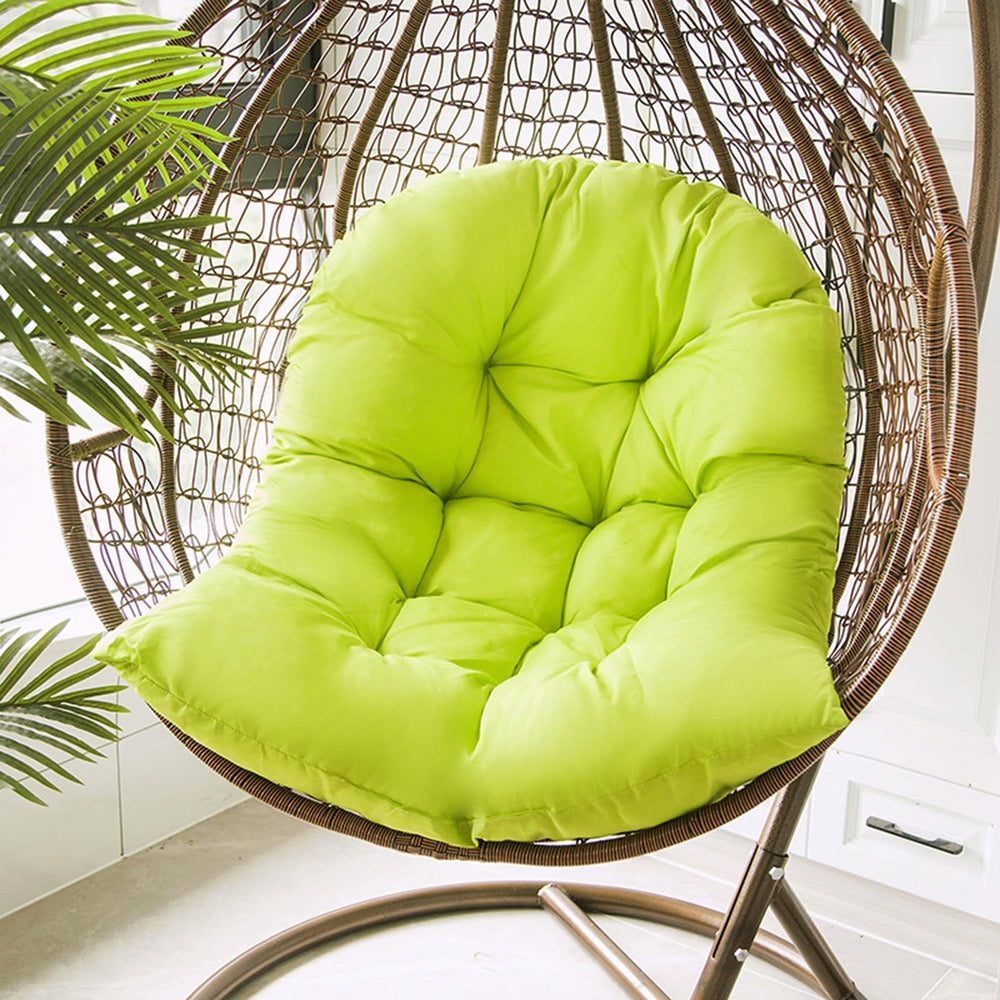 Samtiny on a porch swing in lifestyle shot suggesting cozy outdoor relaxation