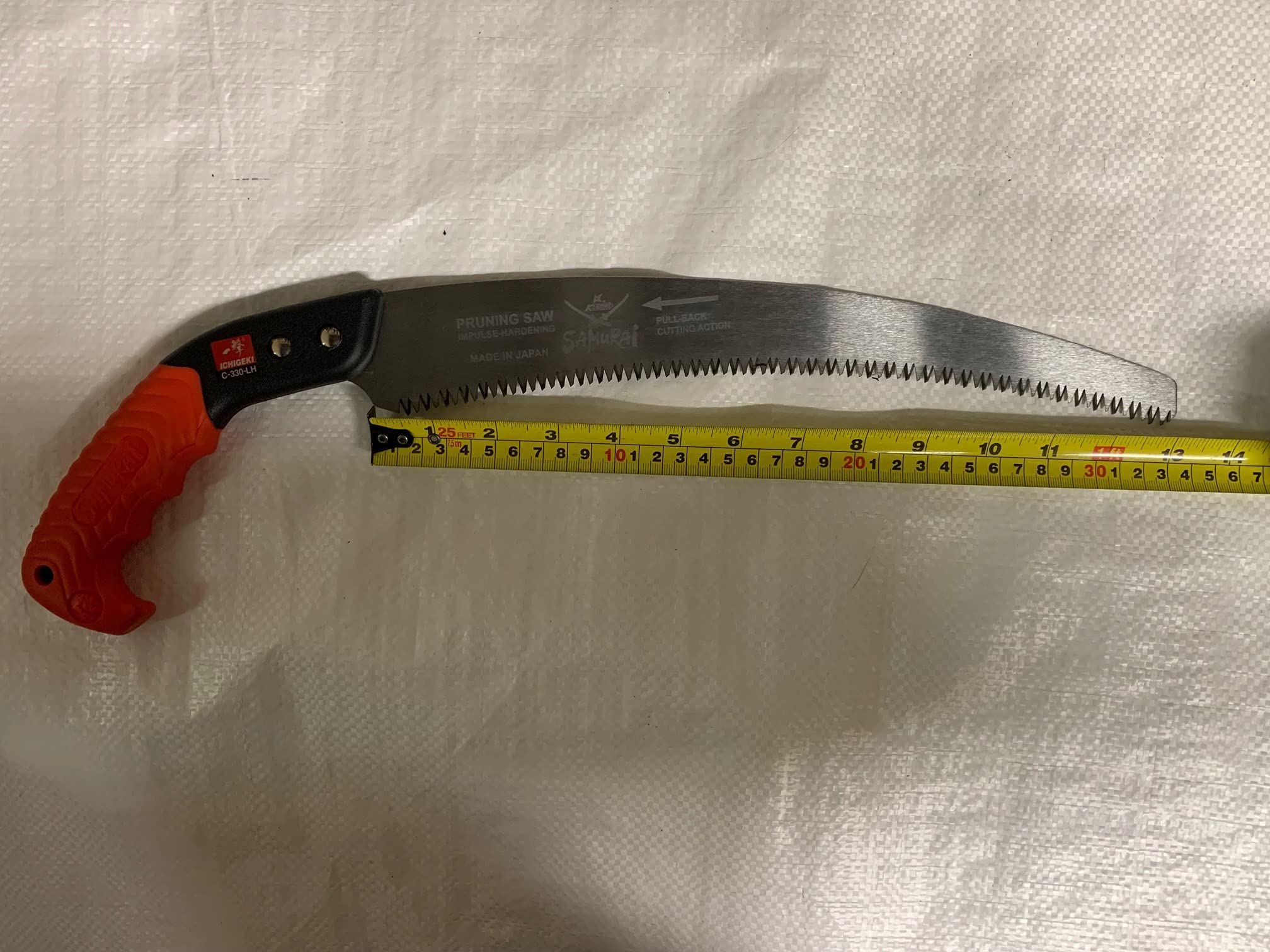 Samurai Kanzawa Ichigeki used in yard setting showing professional-grade pruning convenience