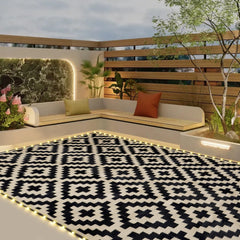 SAND MINE front view of black and beige patio mat showing full layout and benefit