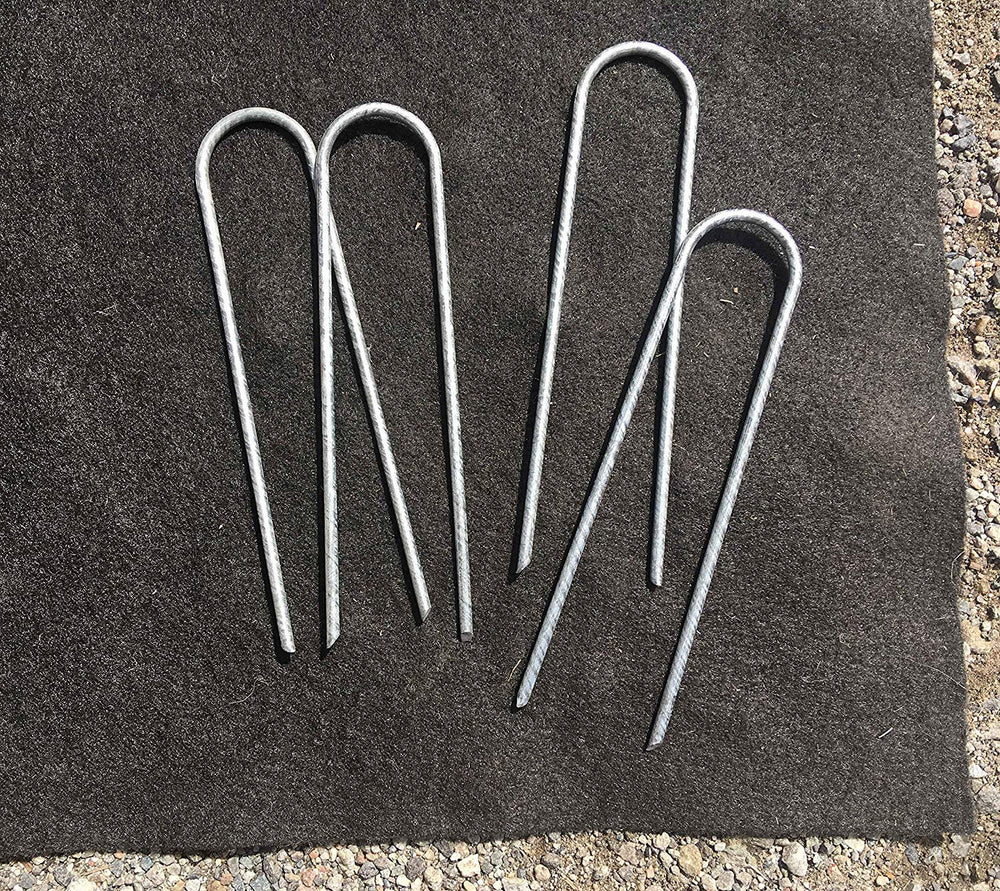 Sandbaggy staples securing drip tubing demonstrating firm hold